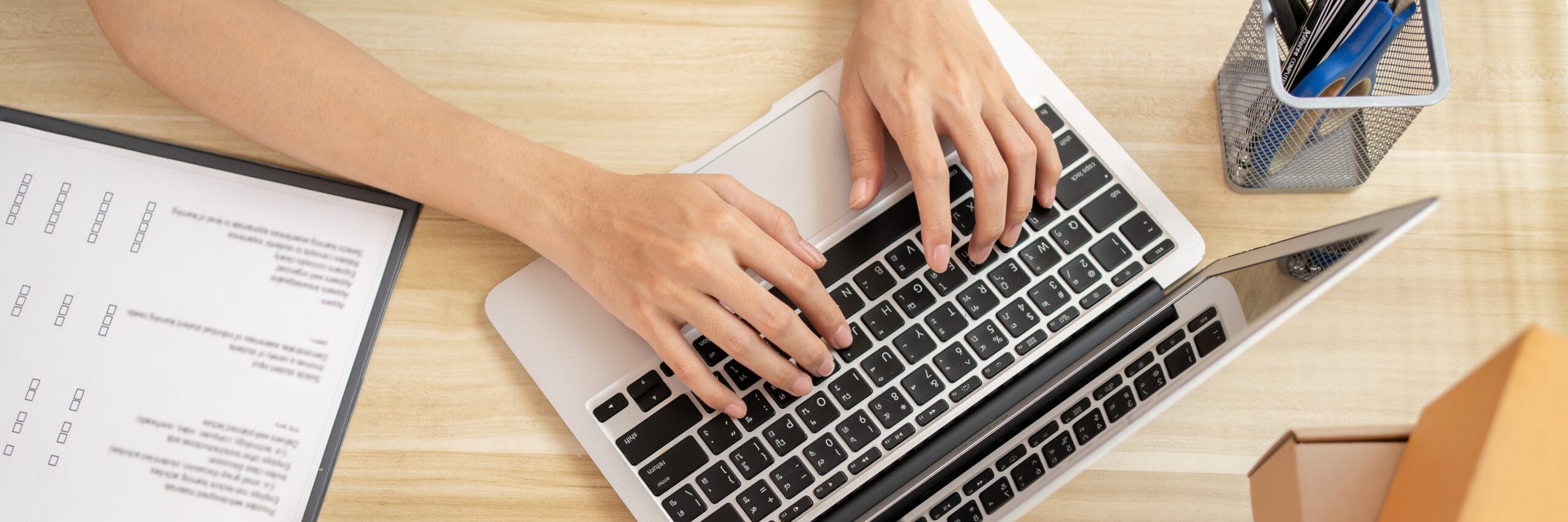 person tipping on computer